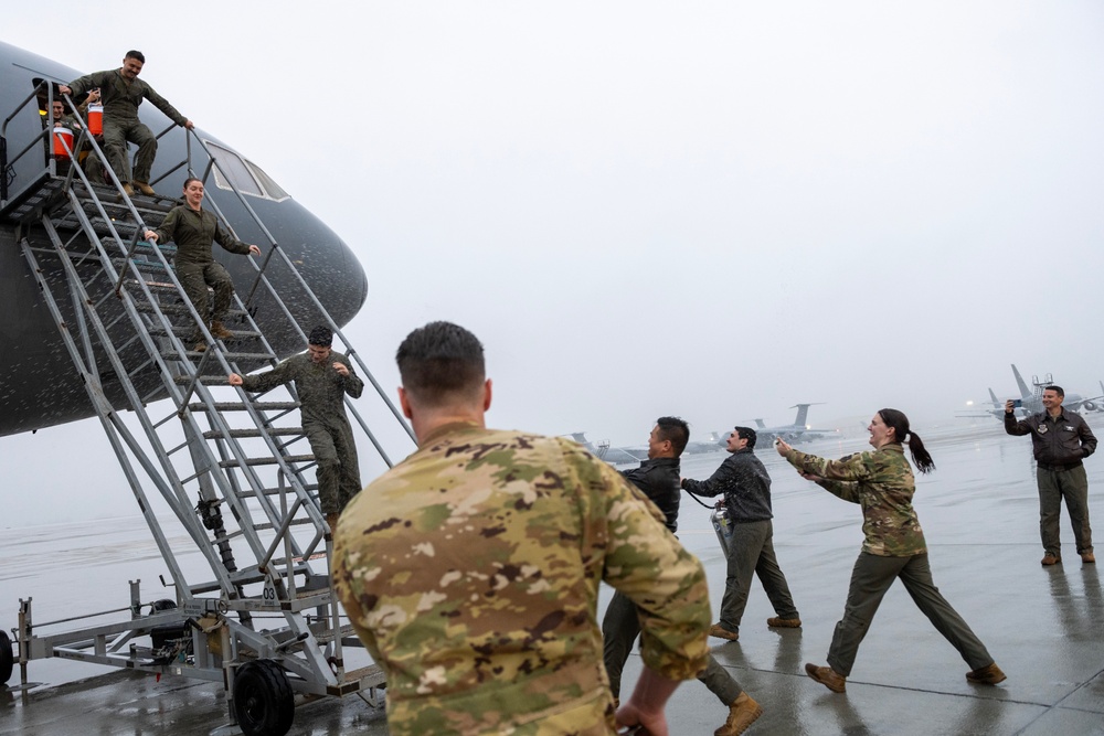 Aircrew members celebrate final flight