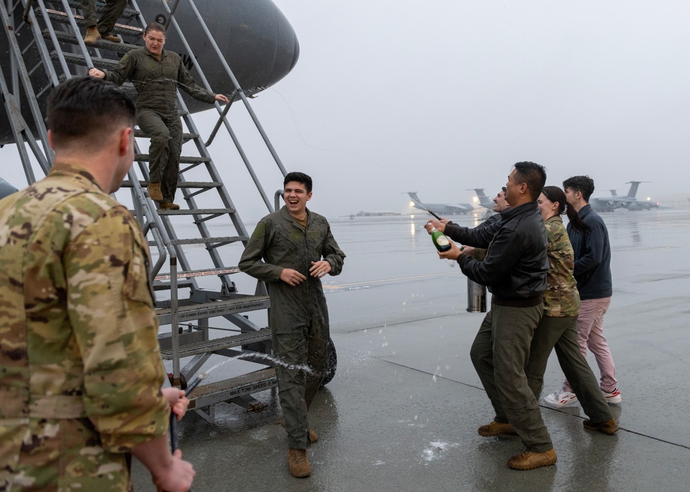 Aircrew members celebrate final flight