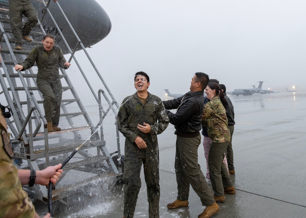 Aircrew members celebrate final flight