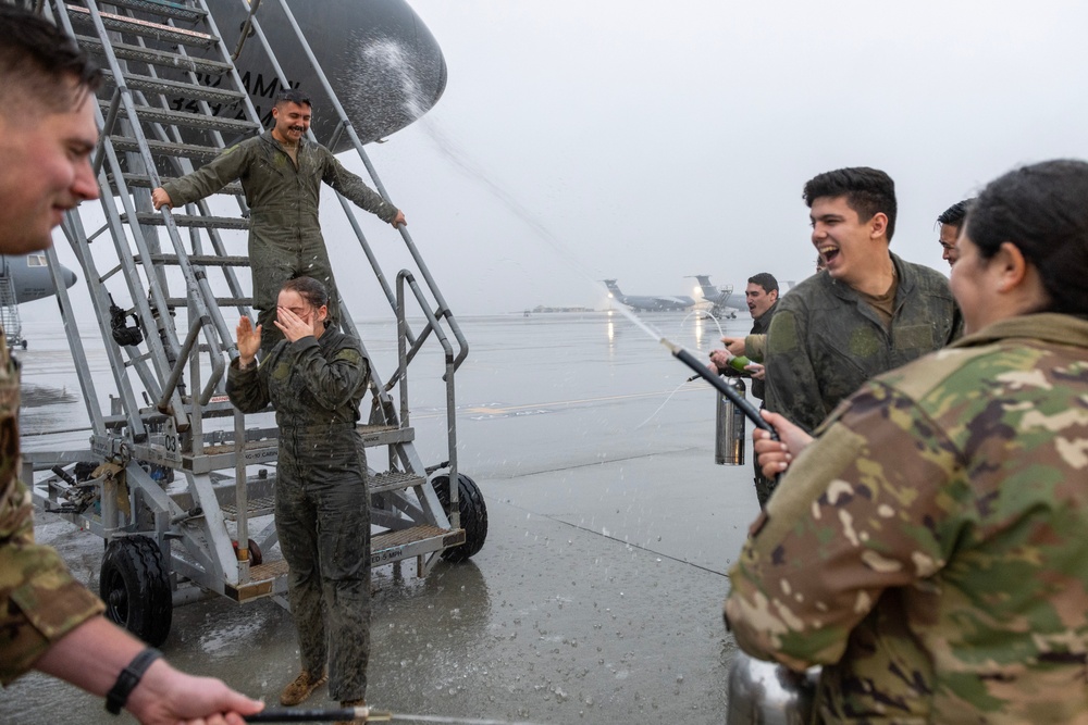 Aircrew members celebrate final flight