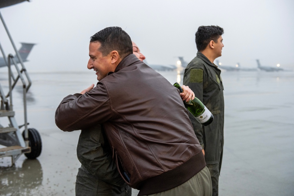 Aircrew members celebrate final flight