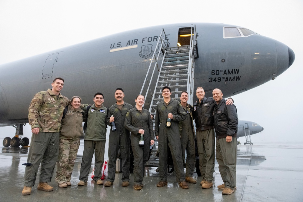 Aircrew members celebrate final flight