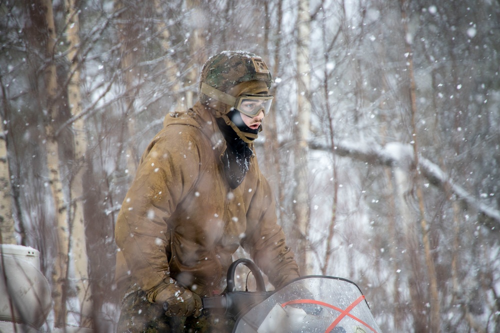 U.S. Marines with II MEF navigate snowy terrain