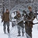 U.S. Marines with 2nd Marine Aircraft Wing set up concertina wire in preparation for Exercise Nordic Response 24