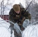 U.S. Marines with 2nd Marine Aircraft Wing set up concertina wire in preparation for Exercise Nordic Response 24