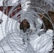 U.S. Marines with 2nd Marine Aircraft Wing set up concertina wire in preparation for Exercise Nordic Response 24