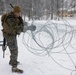 U.S. Marines with 2nd Marine Aircraft Wing set up concertina wire in preparation for Exercise Nordic Response 24