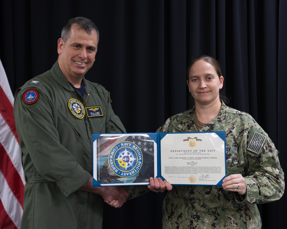Captain William Lane Presents Musician 1st Class Rebecca Jenkins Navy Marine Corp Achievement Medal Award