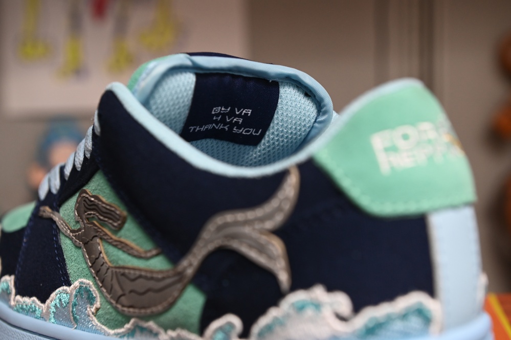 “By VA 4 VA Thank You” reads on the inside tongue of Petty Officer Second Class Kenneth Jones custom created sneaker in Norfolk, Virginia, Nov. 29, 2023.