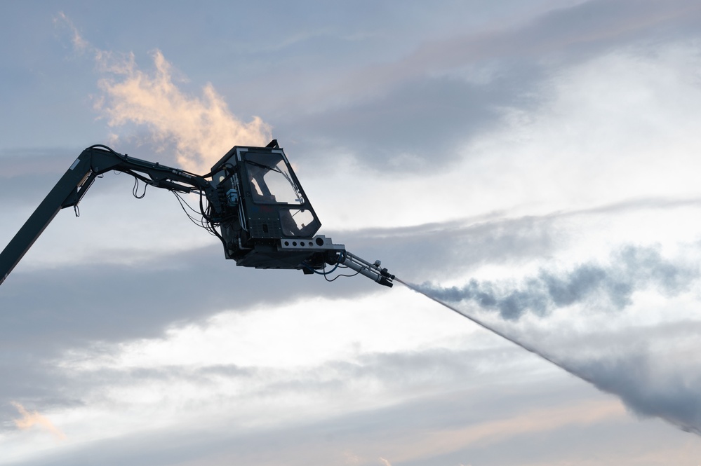 JBER's crew chiefs perform deicing on aircraft