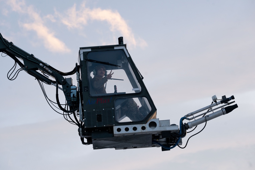 JBER's crew chiefs perform deicing on aircraft