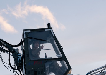 JBER's crew chiefs perform deicing on aircraft