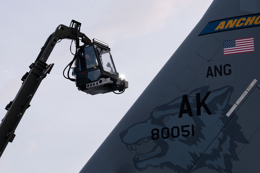 JBER's crew chiefs perform deicing on aircraft