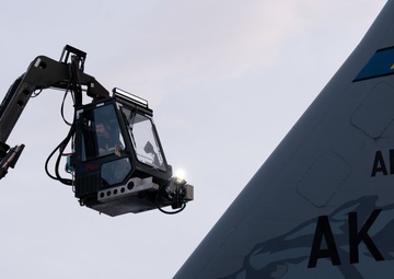 JBER's crew chiefs perform deicing on aircraft