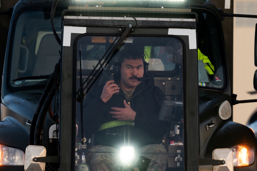 JBER's crew chiefs perform deicing on aircraft
