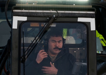 JBER's crew chiefs perform deicing on aircraft