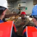 George Washington Sailors participate in a vertical replenishment ordnance onload