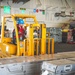 George Washington Sailors participate in a vertical replenishment ordnance onload.