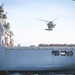 GGeorge Washington Sailors participate in a vertical replenishment ordnance onloadW Sailors participate in a verticale replenishment ordnance onload.