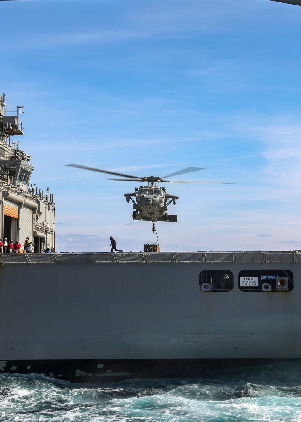 George Washington Sailors participate in a verticale replenishment ordnance onload