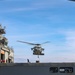 George Washington Sailors participate in a verticale replenishment ordnance onload