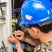 USS Ronald Reagan (CVN 76) Sailors conduct door maintenance