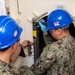 USS Ronald Reagan (CVN 76) Sailors conduct door maintenance