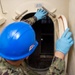 USS Ronald Reagan (CVN 76) Sailors conduct door maintenance