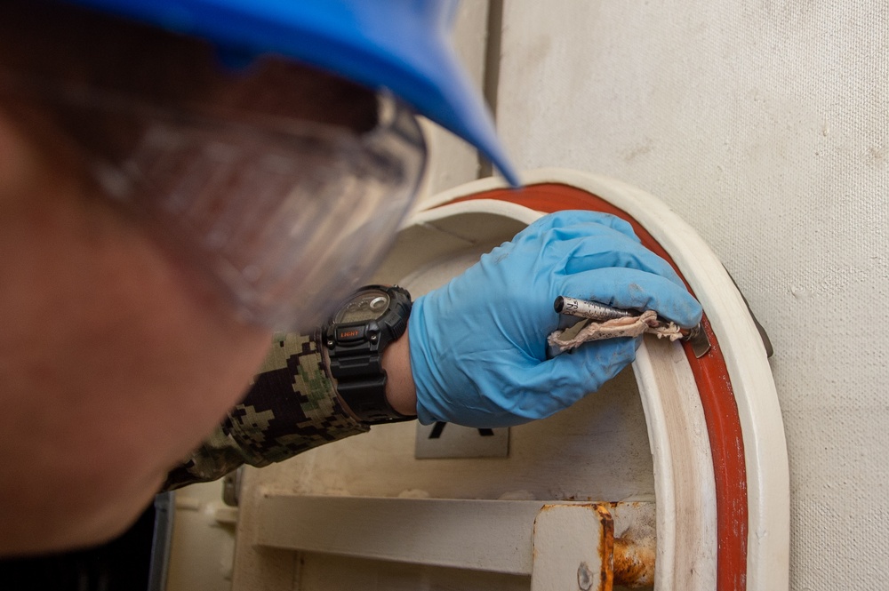 USS Ronald Reagan (CVN 76) Sailors conduct door maintenance