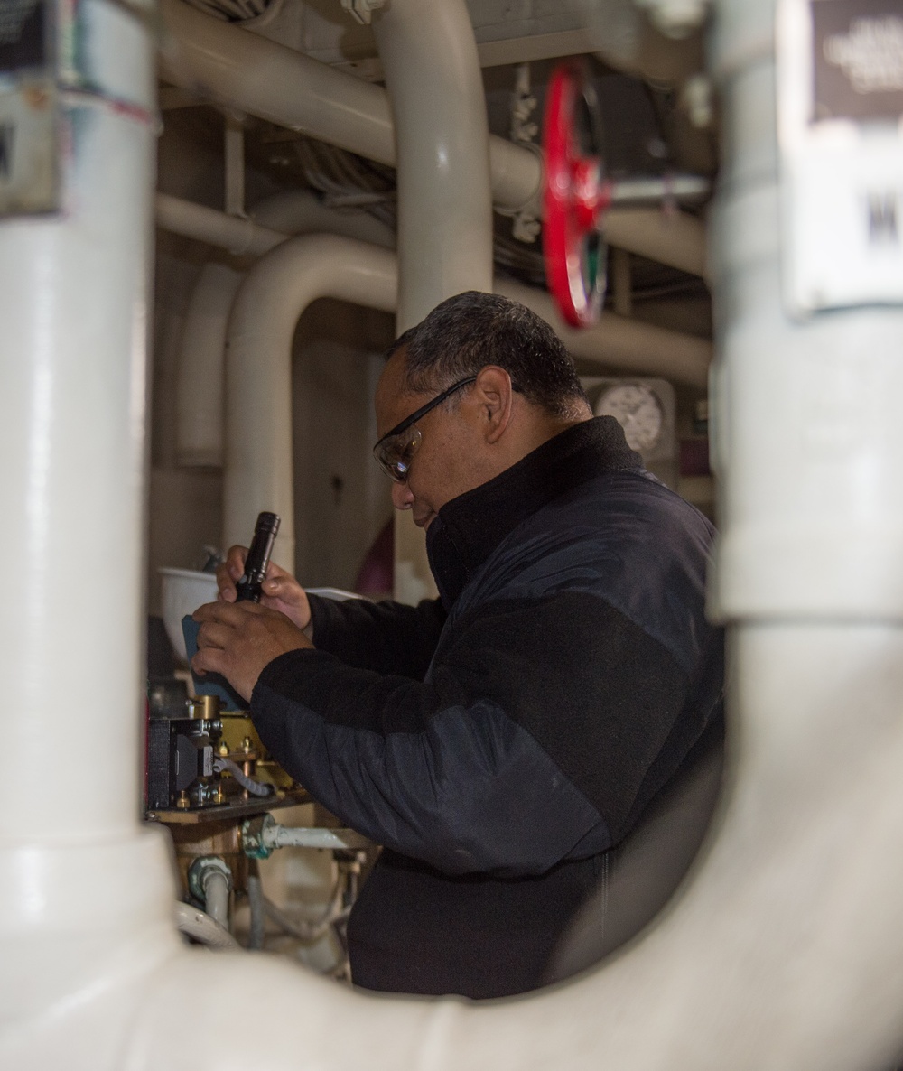 USS Ronald Reagan (CVN 76) Sailors troubleshoot an AFFF station