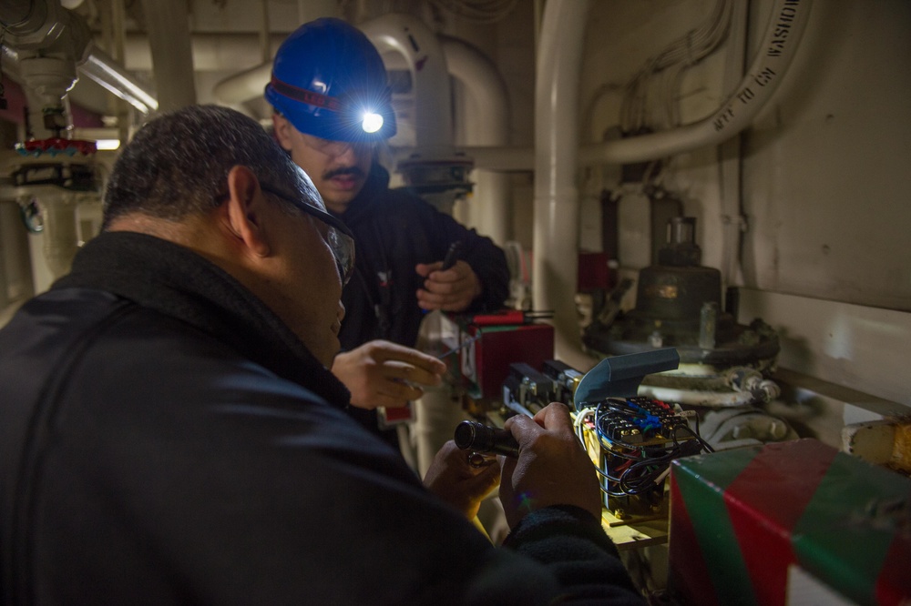 USS Ronald Reagan (CVN 76) Sailors troubleshoot an AFFF station