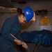 USS Ronald Reagan (CVN 76) Sailors prepare corrosion control tools