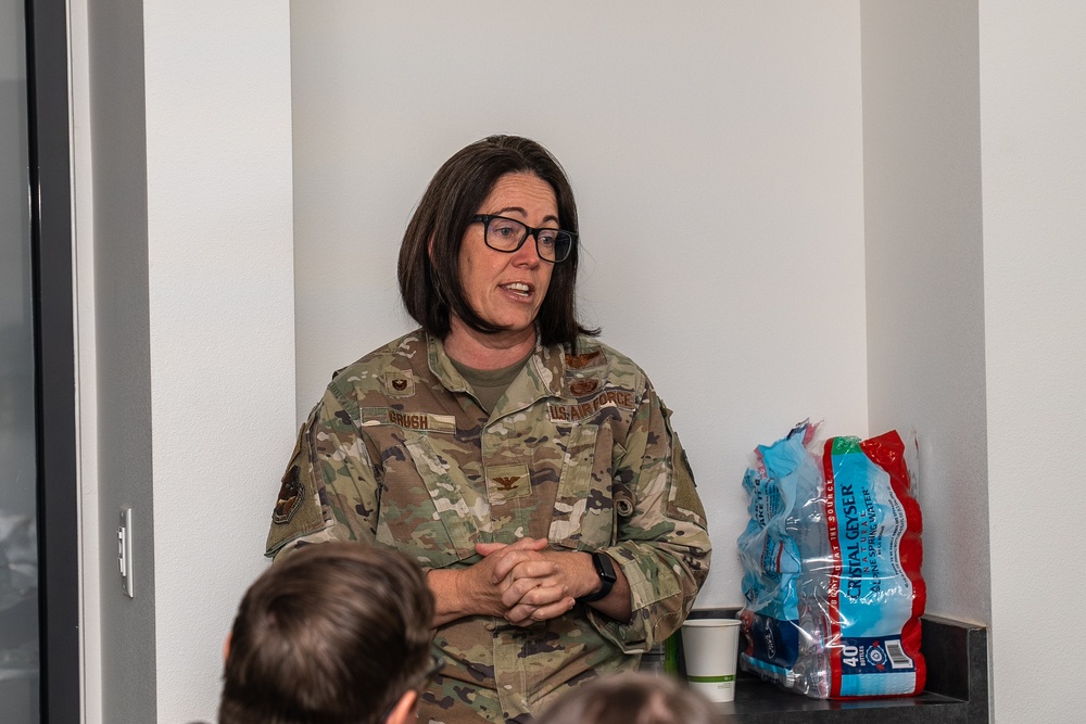 Col. Catherine Grush speaks with congressional staff representatives at Nevada Air National Guard Base