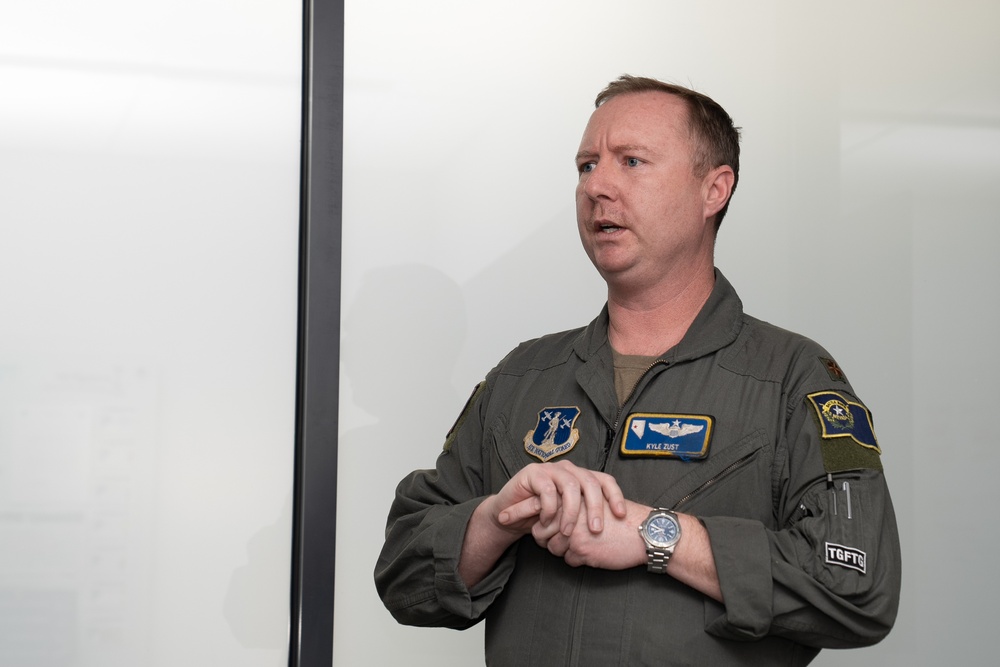 Maj. Kyle Zust addresses congressional staff representatives during their visit to Nevada Air National Guard Base