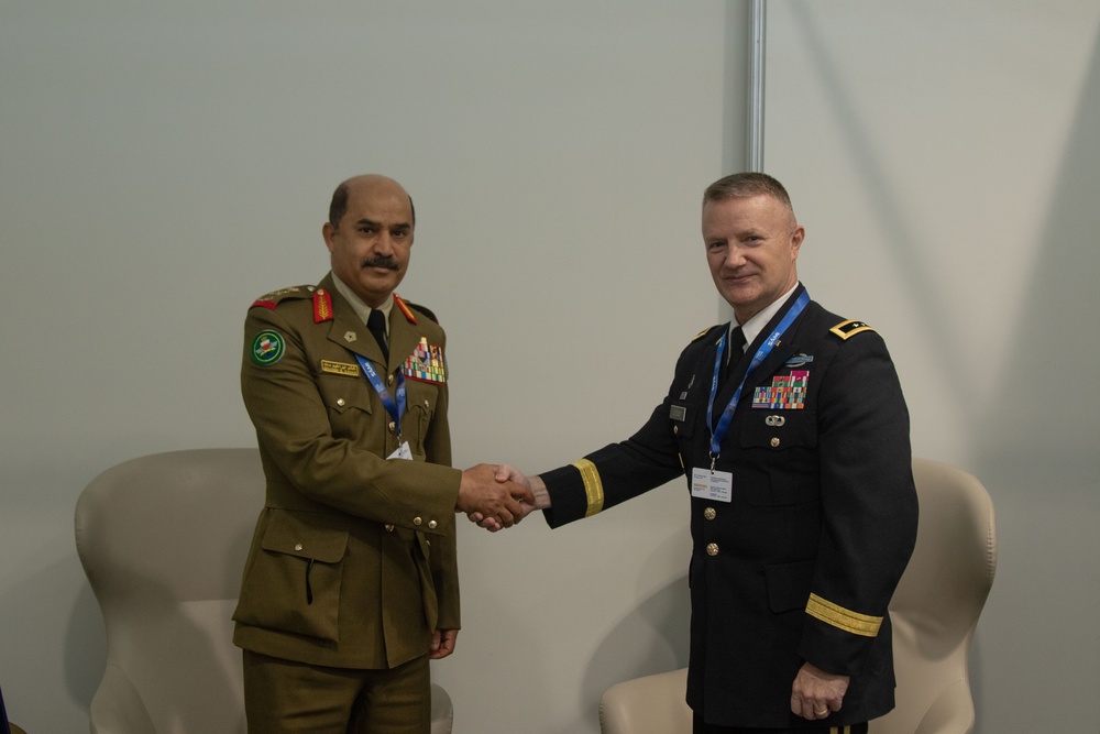 U.S. Army Maj. Gen. Michael Leeney, commanding general of Task Force Spartan, meets with Royal Bahraini Army Maj. Gen. Ghanem Sanad at the World Defense Show