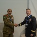 U.S. Army Maj. Gen. Michael Leeney, commanding general of Task Force Spartan, meets with Royal Bahraini Army Maj. Gen. Ghanem Sanad at the World Defense Show