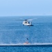 Navy Divers and Helicopter Sea Combat Squadron 23 recover astronauts during Underway Recovery Test 11