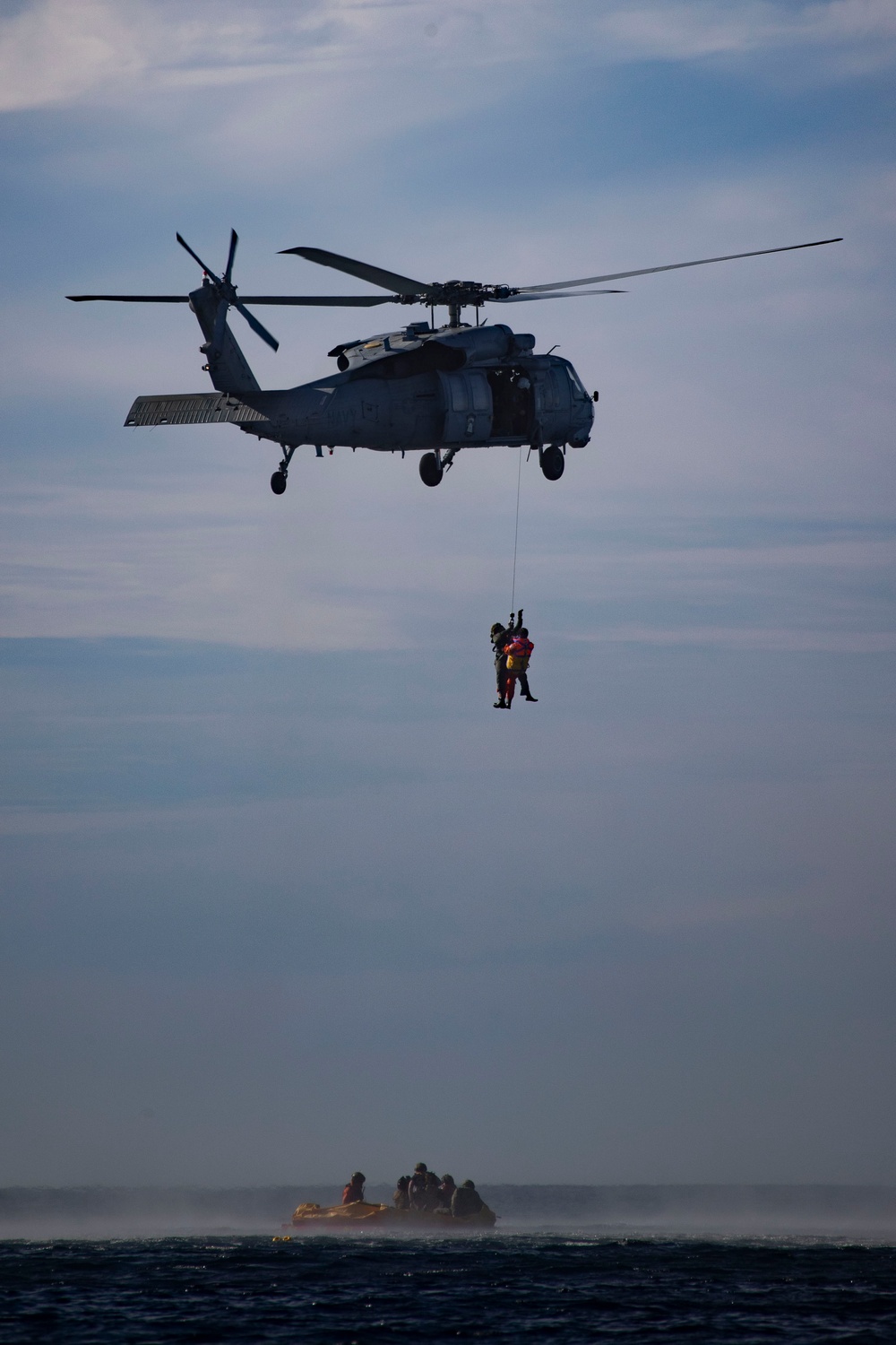 USS San Diego and Helicopter Sea Combat Squadron 23 recover mock astronaut while underway for NASA’s Underway Recovery Test 11