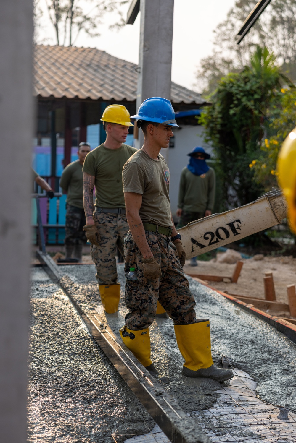 Cobra Gold 24; Marines with Marine Wing Support Squadron 174 pour a concrete pad for the Bankhaocha-Angkromklong School