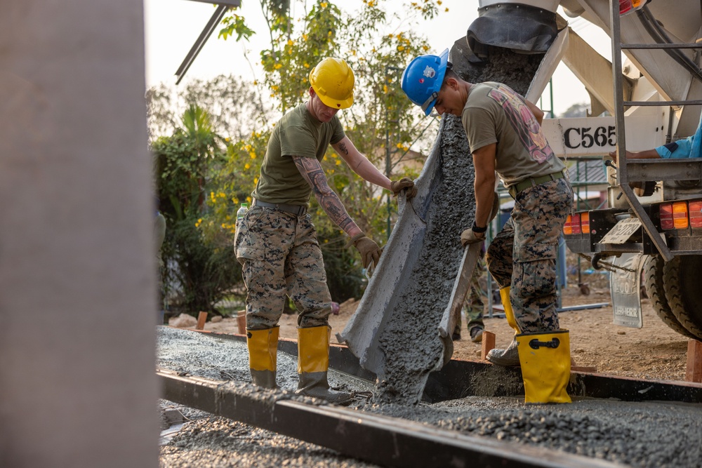 Cobra Gold 24; Marines with Marine Wing Support Squadron 174 pour a concrete pad for the Bankhaocha-Angkromklong School