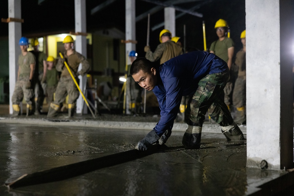 Cobra Gold 24; Marines with Marine Wing Support Squadron 174 pour a concrete pad for the Bankhaocha-Angkromklong School