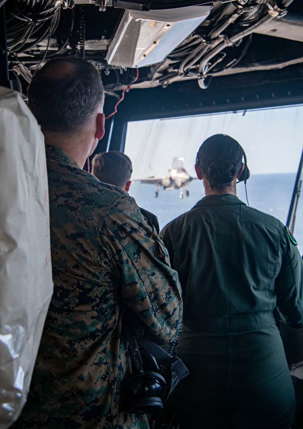 Maj. Gen. Eric E. Austin, commanding general of 1st Marine Aircraft Wing, visits the Pilot House of USS America (LHA 6)