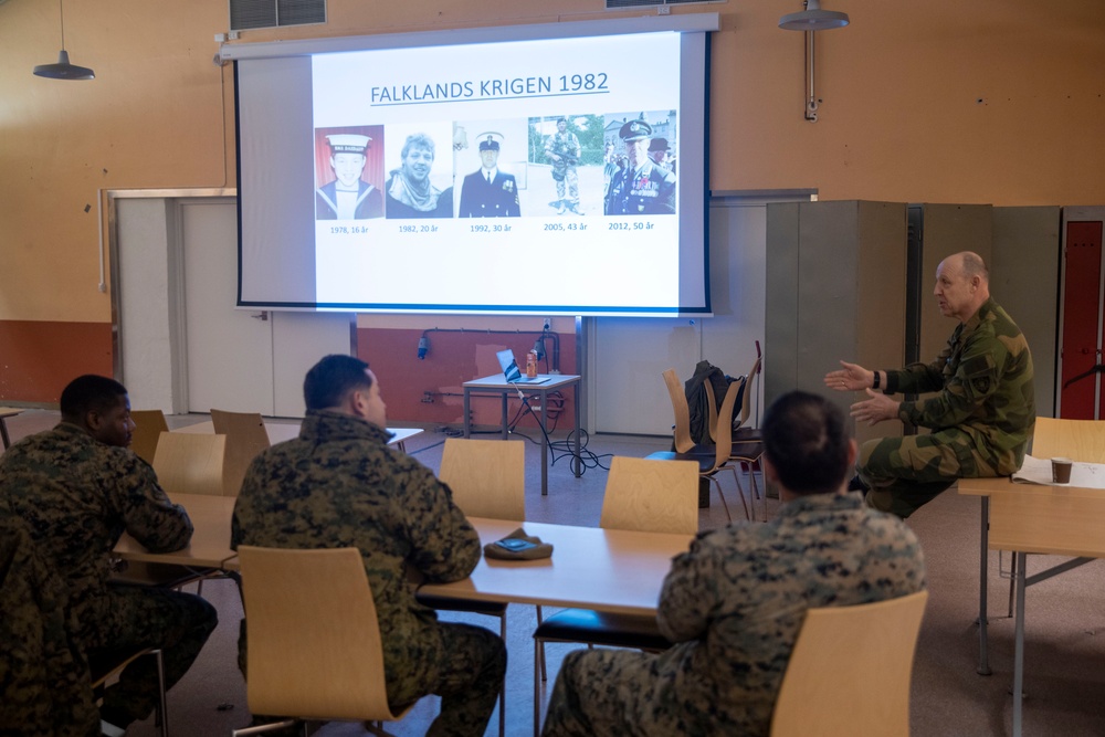 Norwegian Maj. Kevin Watton speaks with II MEF Marines about his military background