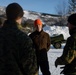 U.S. Marines demonstrate an M142 High Mobility Artillery Rocket System to Norwegian Army leaders