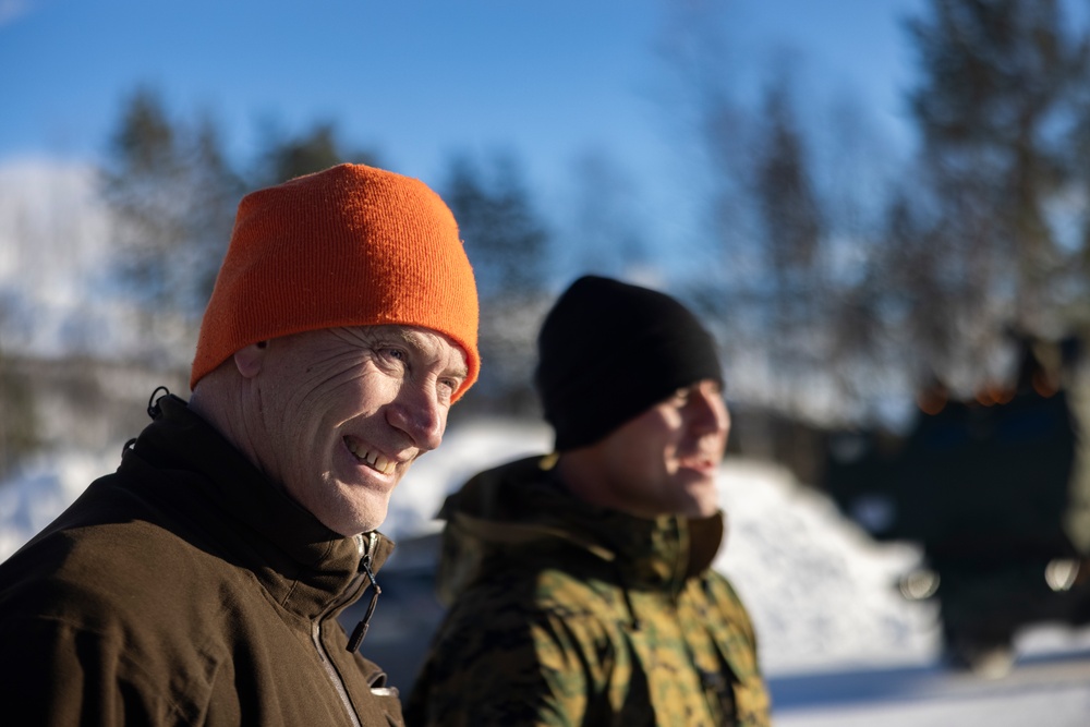 U.S. Marines demonstrate an M142 High Mobility Artillery Rocket System to Norwegian Army leaders