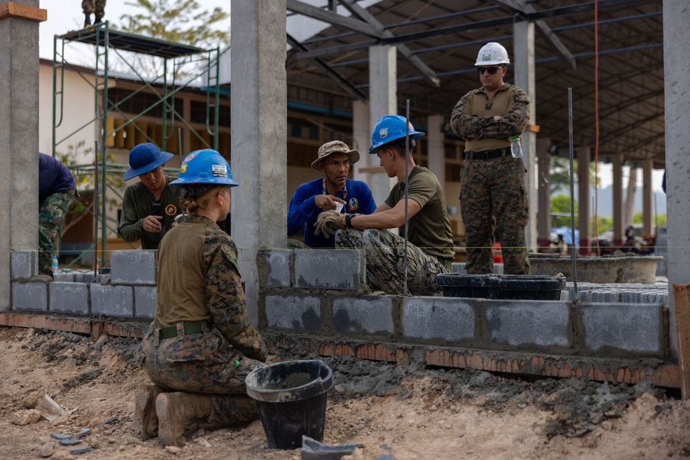 Cobra Gold 24; Marines With Marine Wing Support Squadron 174 lay bricks at the Bankhaocha-Angkromklong School