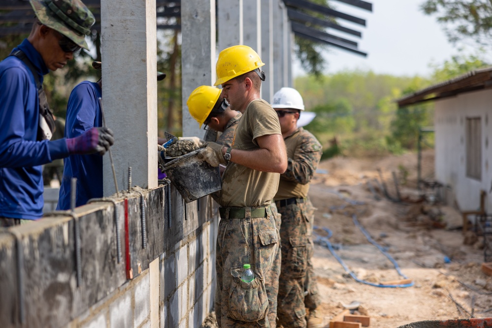 Cobra Gold 24; Marines With Marine Wing Support Squadron 174 lay bricks at the Bankhaocha-Angkromklong School