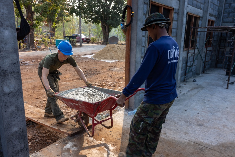 Cobra Gold 24; Marines with Marine Wing Support Squadron 171 apply stucco at the Ban Prakaet School