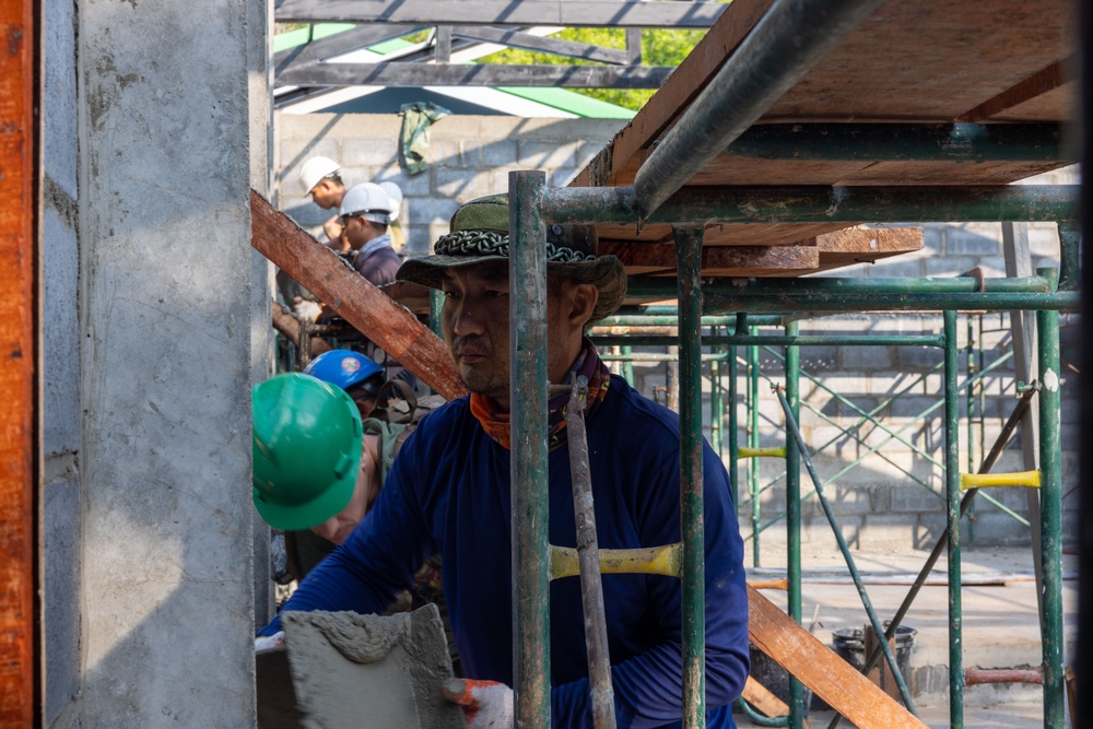 Cobra Gold 24; Marines with Marine Wing Support Squadron 171 apply stucco at the Ban Prakaet School