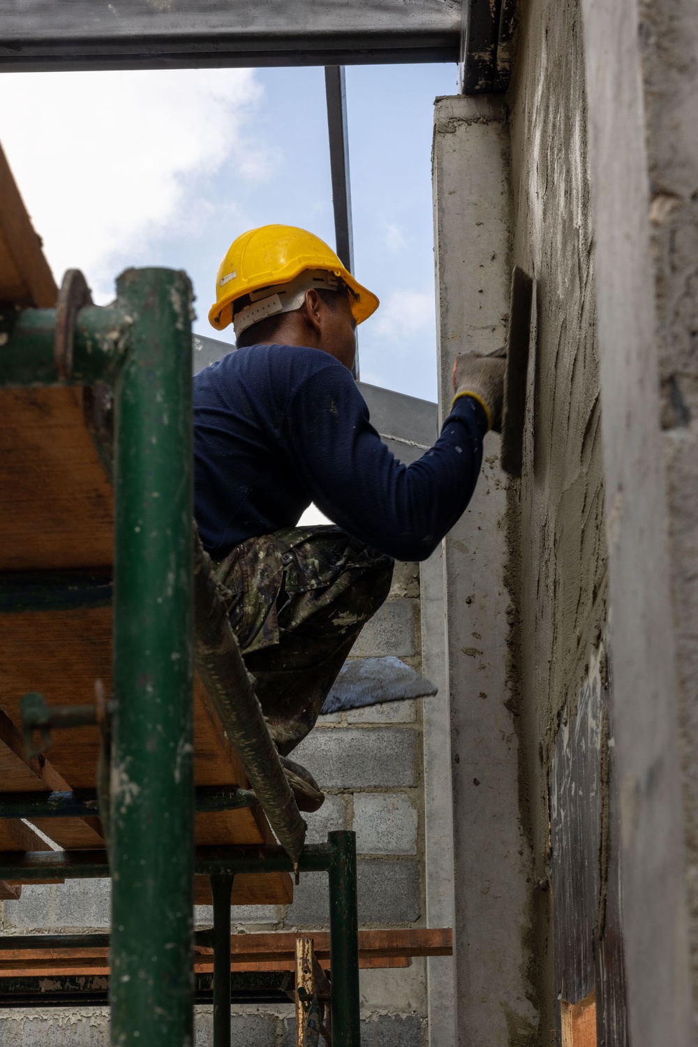 Cobra Gold 24; Marines with Marine Wing Support Squadron 171 apply stucco at the Ban Prakaet School